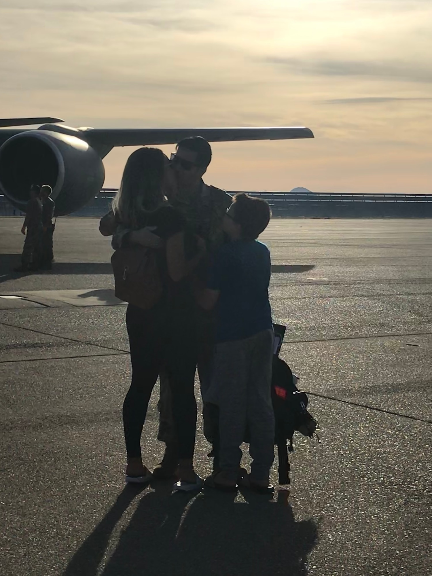 Master Sgt. Michael Carrillo, a dedicated crew chief with the 940th Aircraft Maintenance Squadron, gives hugs and kisses to his wife and son June 14, 2020, at Beale Air Force Base, California.