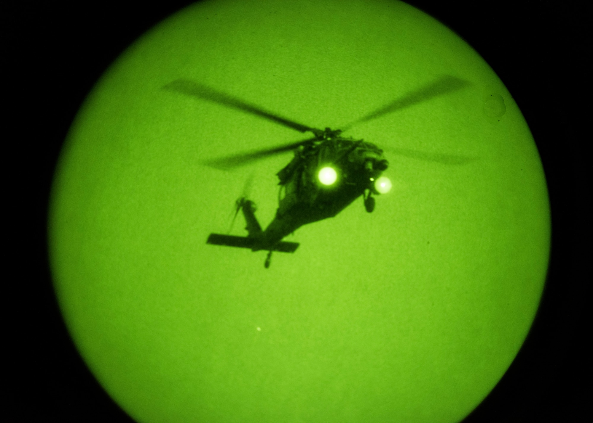 A photo of an HH-60 flying