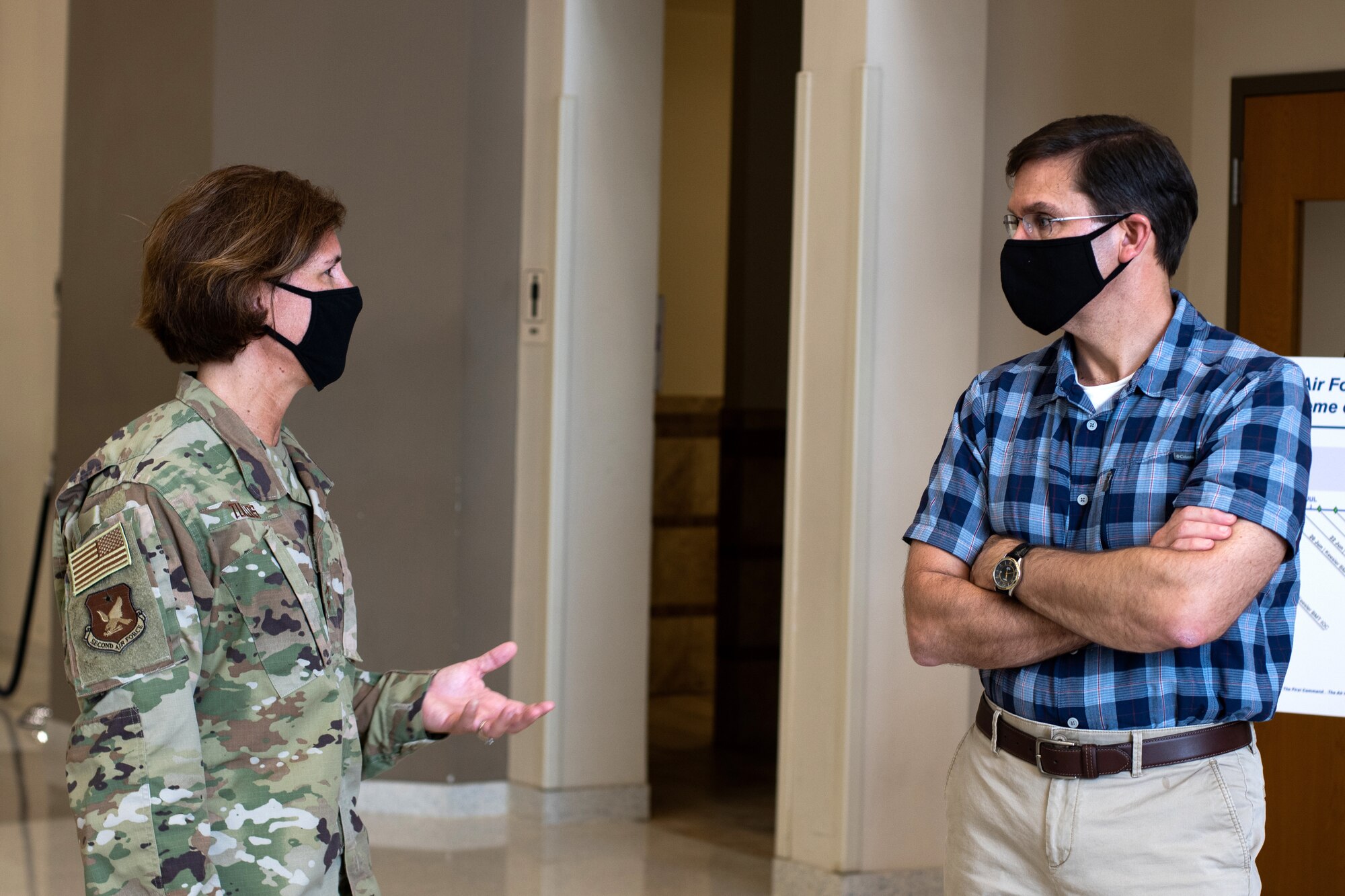 U.S. Air Force Maj. Gen. Andrea Tullos (left), 2nd Air Force commander, briefs Defense Secretary Dr. Mark T. Esper (right), during a tour of the Pfingston Reception Center June 16, 2020, at Joint Base San Antonio-Lackland, Texas. Esper met with AETC leaders to see firsthand how Basic Military Training is fighting through COVID-19 with health protection measures in place and adapting operations to current Centers for Disease Control and Prevention Guidance. The visit also allowed him to witness how a citizen becomes an Airman during COVID-19. (U.S. Air Force photo by Sarayuth Pinthong)