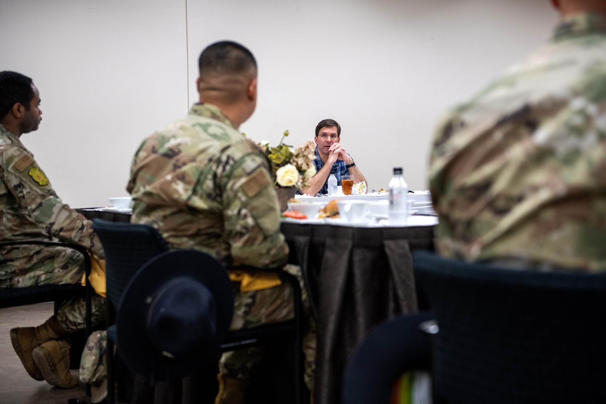 U.S. Secretary of Defense Dr. Mark T. Esper (center) meets with Noncommissioned Officers and Company Grade Officers for a working lunch during a tour of the Pfingston Reception Center June 16, 2020, at Joint Base San Antonio-Lackland, Texas. Esper met with AETC leaders to see firsthand how Basic Military Training is fighting through COVID-19 with health protection measures in place and adapting operations to current Centers for Disease Control and Prevention Guidance. The visit also allowed him to witness how a citizen becomes an Airman during COVID-19. (U.S. Air Force photo by Sarayuth Pinthong)