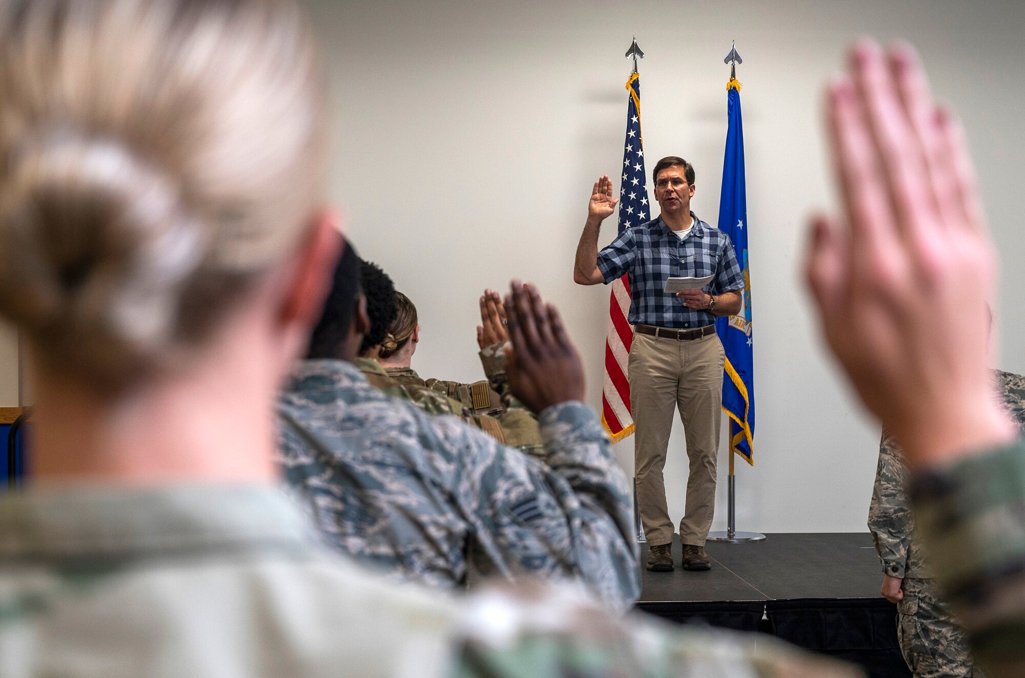 U.S. Secretary of Defense Dr. Mark T. Esper administers the oath of enlistment during his visit June 16, 2020, at Joint Base San Antonio-Lackland, Texas. Esper met with AETC leaders to see firsthand how Basic Military Training is fighting through COVID-19 with health protection measures in place and adapting operations to current Centers for Disease Control and Prevention Guidance. The visit also allowed him to witness how a citizen becomes an Airman during COVID-19.