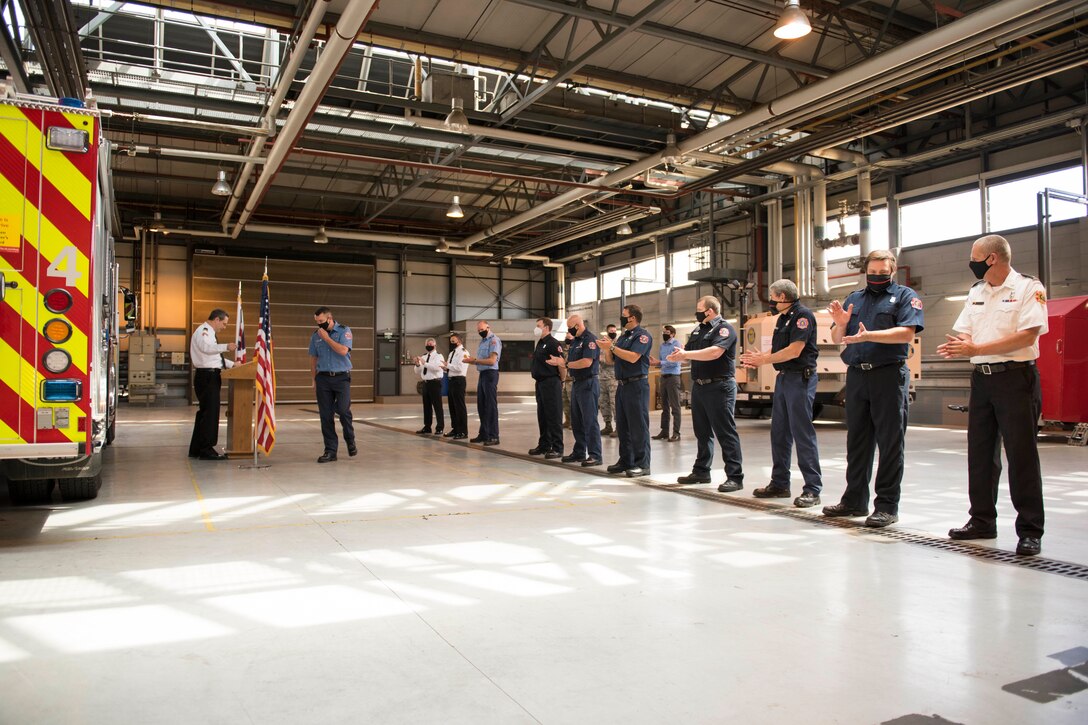 Lee Joyce, 423rd Civil Engineer Squadron lead firefighter, is awarded the Fire Department’s Life Saving Medal at RAF Alconbury, England, June 16, 2020, for saving his daughter’s life. Lee utilized his firefighter training to assist his four-year-old daughter when she was chocking on a chocolate egg May 16, 2020. (U.S. Air Force photo by Airman 1st Class Jennifer Zima)