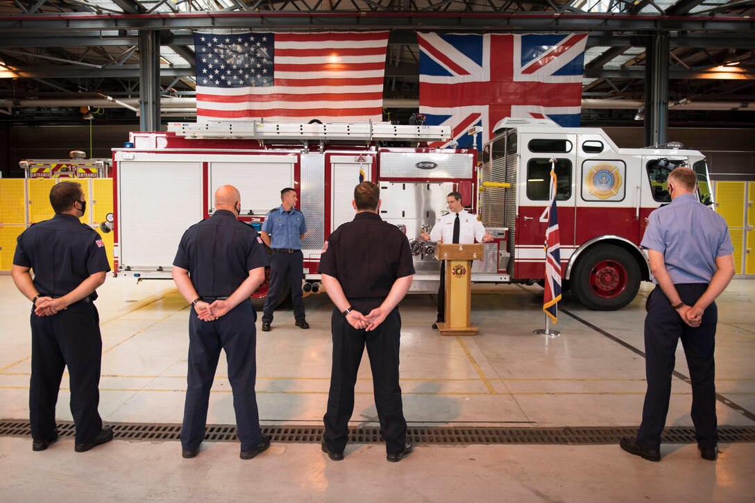 Lee Joyce, 423rd Civil Engineer Squadron lead firefighter, is awarded the Fire Department’s Life Saving Medal at RAF Alconbury, England, June 16, 2020, for saving his daughter’s life. Lee utilized his firefighter training to assist his four-year-old daughter when she was chocking on a chocolate egg May 16, 2020. (U.S. Air Force photo by Airman 1st Class Jennifer Zima)