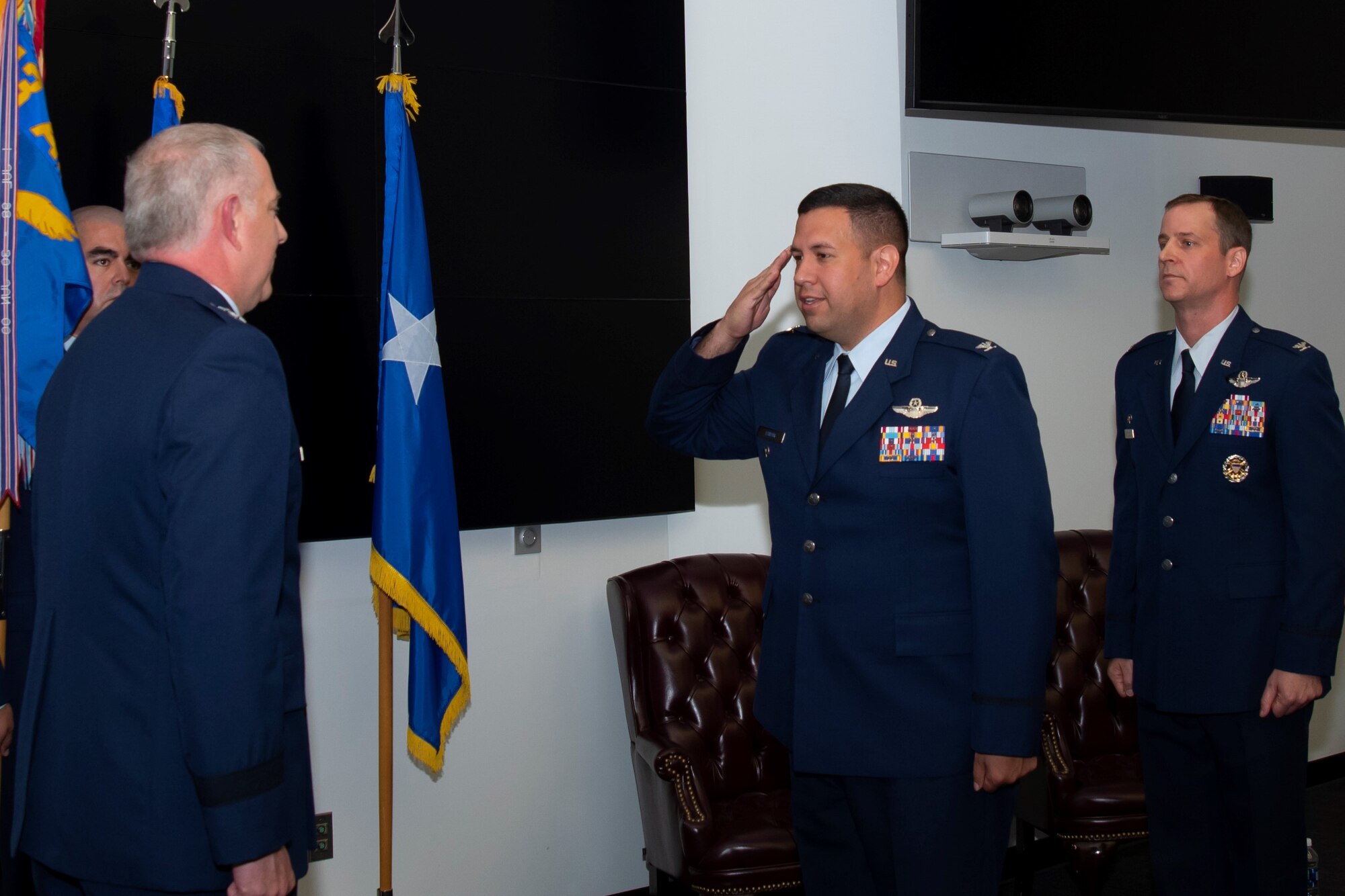 Col. Joseph "Jacko" M. Vanoni (center) assumes command of the 43d Air Mobility Operations Group from Col. Timothy S. Danielson (right). Maj. Gen. John R. Gordy (left), commander of the U.S. Air Force Expeditionary Center at Joint Base McGuire-Dix-Lakehurst, N.J., presided over the change of command ceremony.