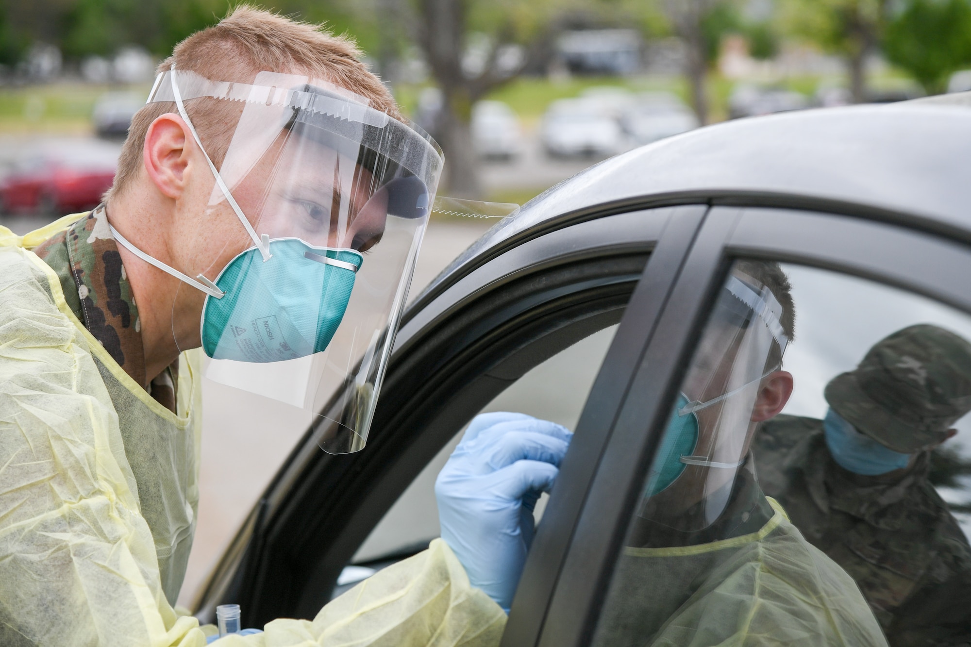 Staff Sgt. Asa Stansbury, 75th Medical Group, swabs an Airman for COVID-19.