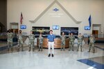 Defense Secretary Dr. Mark T. Esper (center) poses for a group photo with Noncommissioned Officers and Company Grade Officers during a tour of the Pfingston Reception Center June 16, 2020, at Joint Base San Antonio-Lackland, Texas. Esper met with AETC leaders to see firsthand how Basic Military Training is fighting through COVID-19 with health protection measures in place and adapting operations to current Centers for Disease Control and Prevention Guidance. The visit also allowed him to witness how a citizen becomes an Airman during COVID-19. (U.S. Air Force photo by Sarayuth Pinthong)