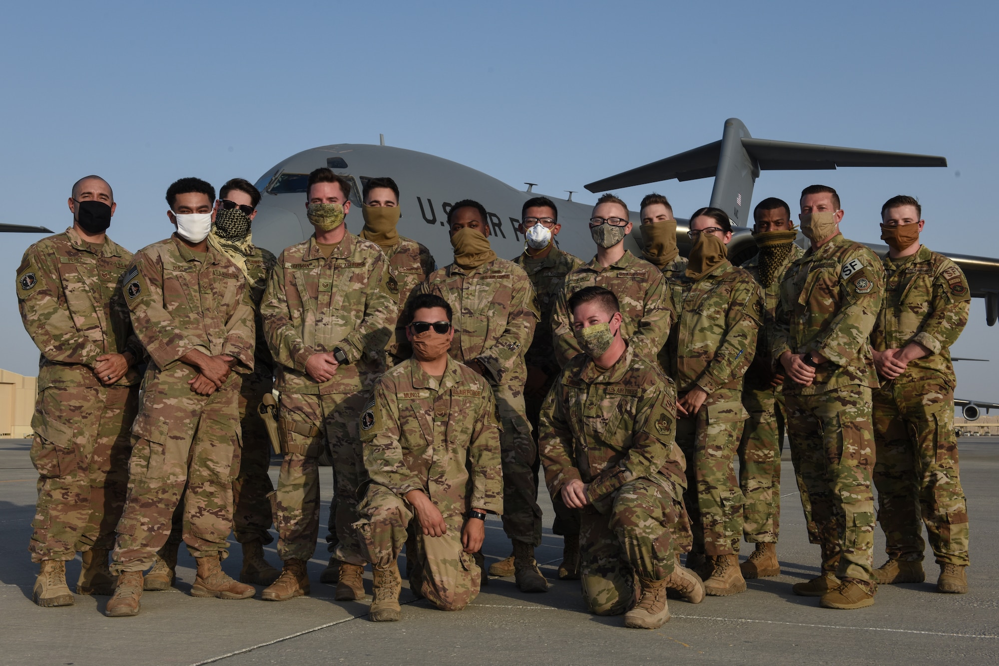 The 816th Expeditionary Airlift Squadron Ravens and Fly Away Security Team members pose for a photo at Al Udeid Air Base, Qatar, June 4, 2020. The 8 EAS Ravens and FAST Airmen work together to ensure the safety of an aircraft and its crew in austere locations. (U.S. Air Force photo by Senior Airman Shay Stuart)