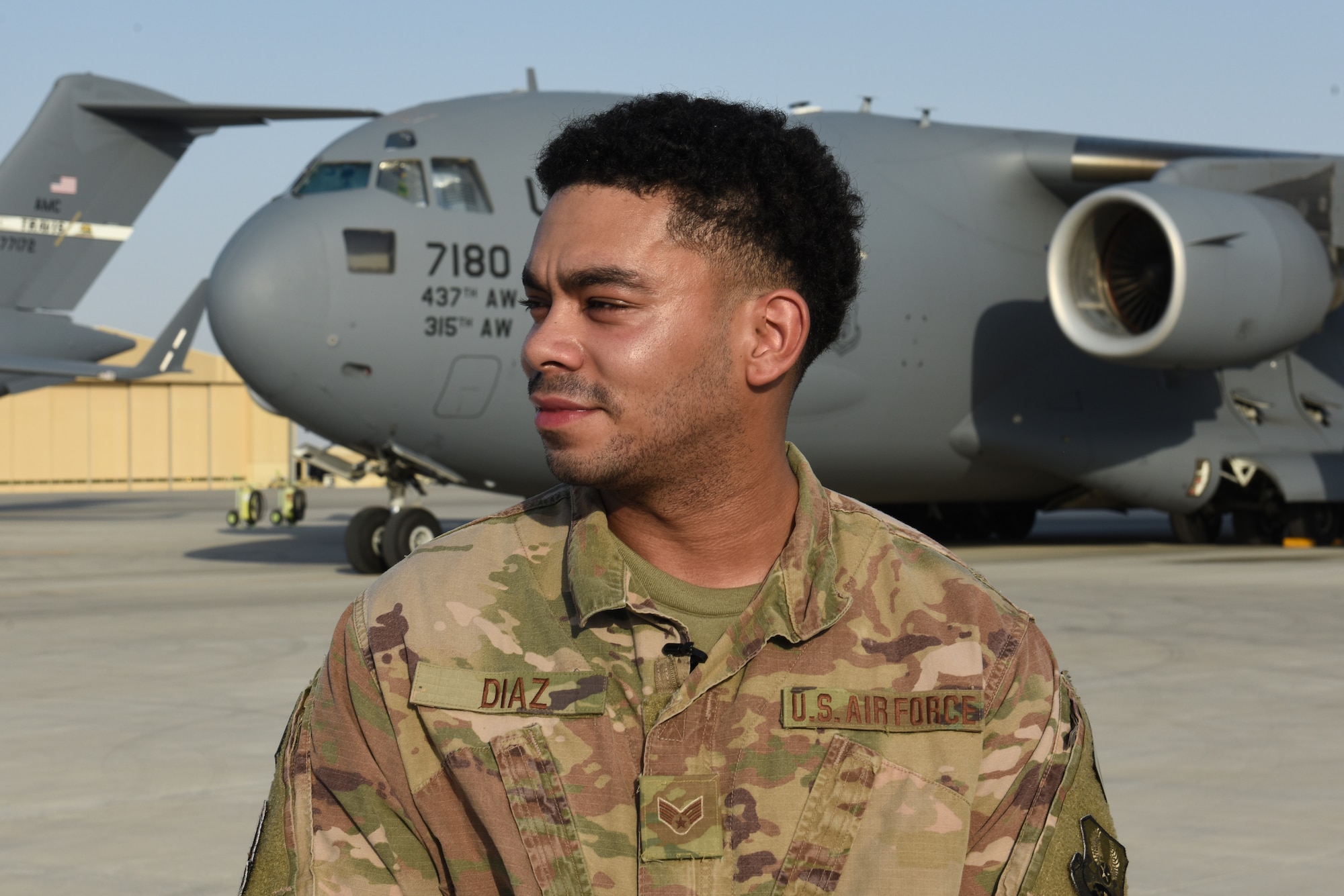 Senior Airman Justin Diaz, 816th Expeditionary Airlift Squadron Fly Away Security Team member, stands on the flight line at Al Udeid Air Base, Qatar, June 4, 2020. FAST members are trained Security Forces Airmen who work alongside U.S. Air Force Phoenix Ravens to secure flight lines in the U.S. Air Forces Central Command Area of Responsibility and ensure safety of an aircraft and its crew. (U.S. Air Force photo by Senior Airman Shay Stuart)