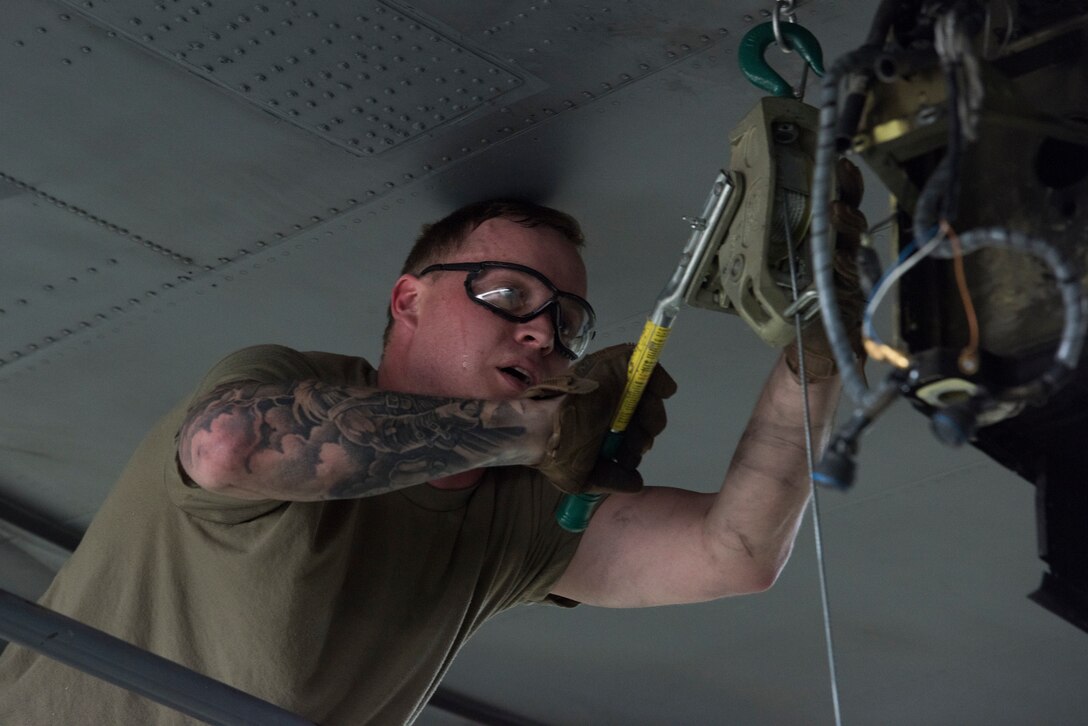 A photo of an Airman working on an aircraft.
