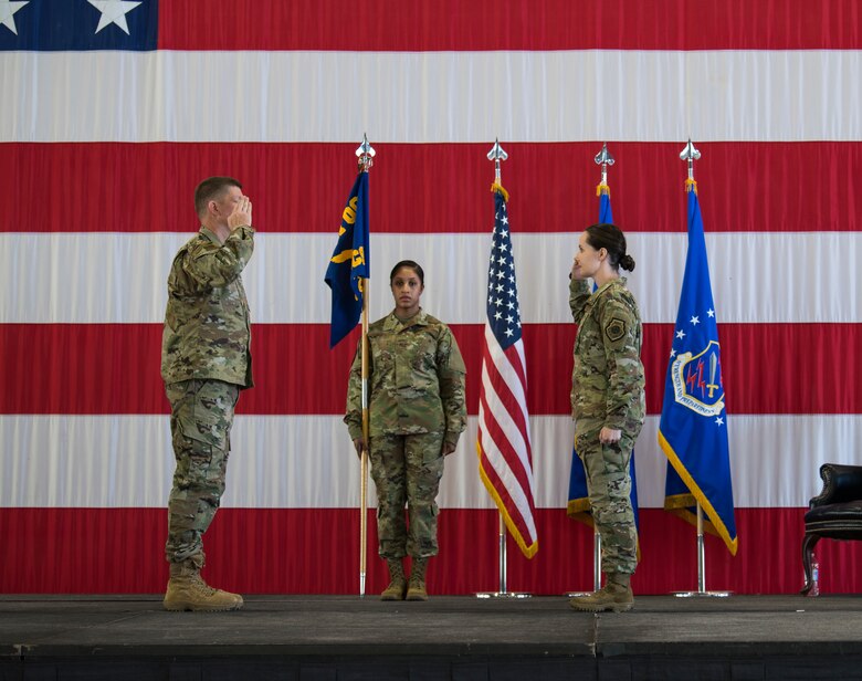 Lt. Col. Kara Sartori (right) salutes Col. John Thien, 721st Operations Group commander, to assume command of the 4th Space Control Squadron on June 16, 2020 at Peterson Air Force Base, Colorado. The tradition of the passing of the unit guidon did not occur in order to maintain proper physical distancing guidelines due to COVID-19. (U.S. Air Force photo by Airman 1st Class Andrew Bertain)
