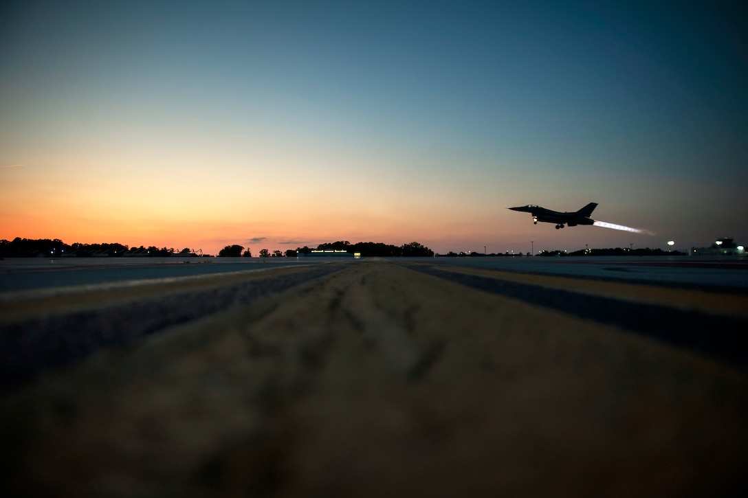 An aircraft takes off at night.