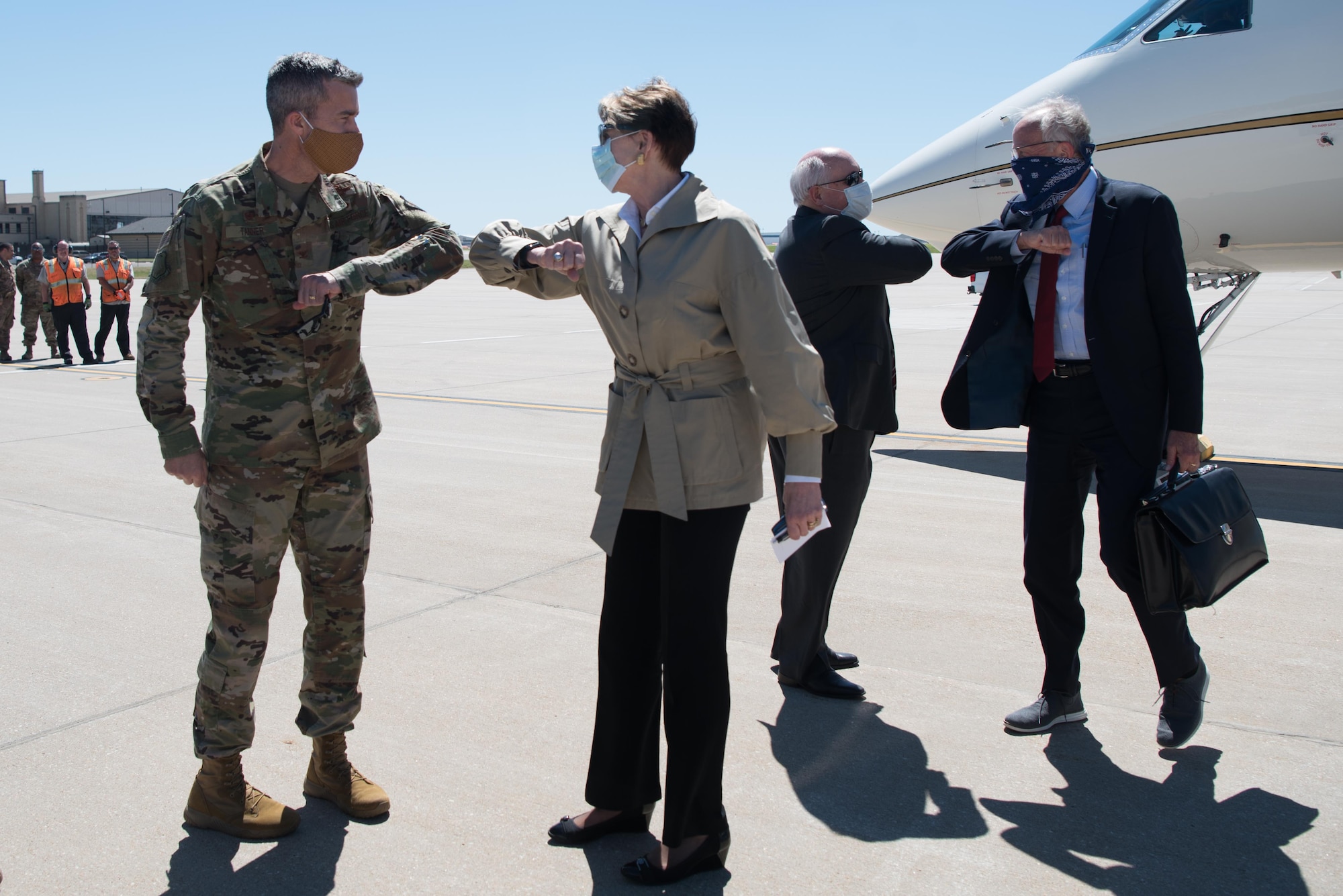 Col. Richard Tanner, 22nd Air Refueling Wing commander, greets Secretary of the Air Force Barbara Barrett, as U.S. Rep. Ron Estes greets U.S. Sen. Jerry Moran, upon their arrival June 10, 2020, at McConnell Air Force Base, Kansas. Barrett visited Team McConnell to interact with Airmen and receive a comprehensive KC-46A Pegasus immersion. (U.S. Air Force photo by Senior Airman Alexi Bosarge)