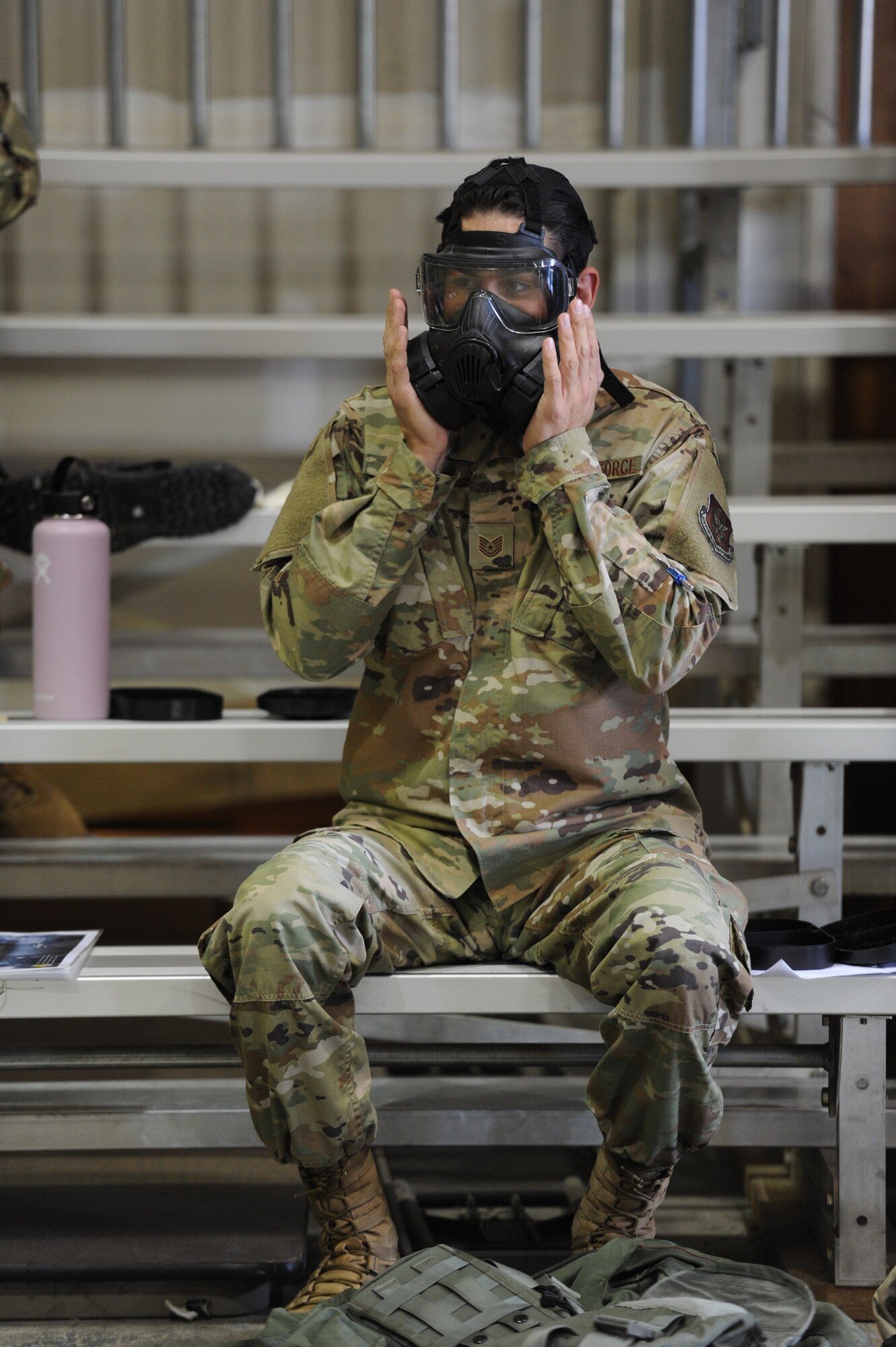 Tech. Sgt. Javier Mendoza, 940th Air Refueling Wing ground transport technician, checks the seal on his gas mask June 13, 2020, at Beale Air Force Base, California.