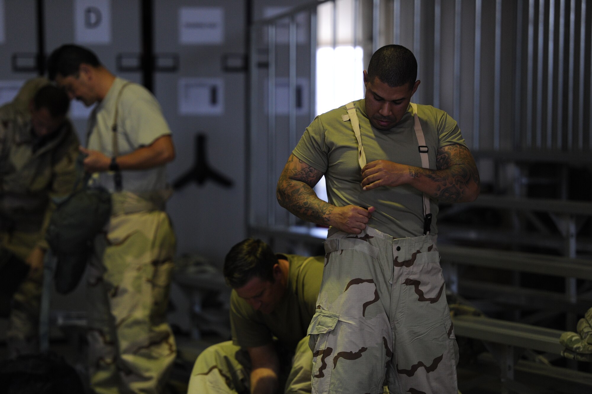 Staff Sgt. Gilbert Brooks, assigned to the 940th Logistics Readiness Squadron secures his chemical, biological, radiological and nuclear trousers June 13, 2020, at Beale Air Force Base, California.