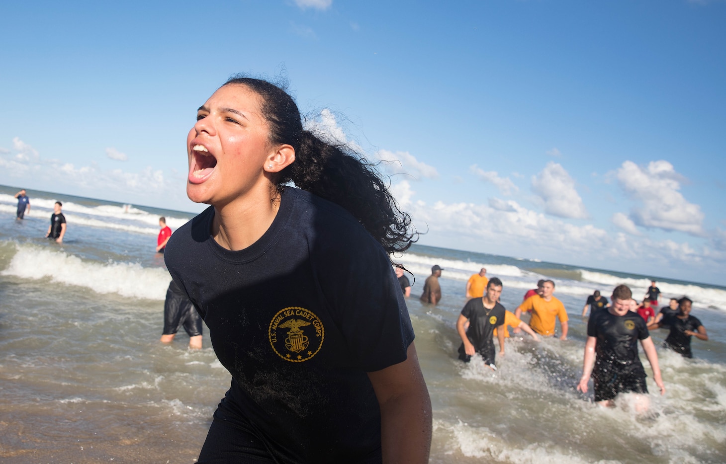 171104-N-PJ969-1169 FORT PIERCE, Fla., (Nov. 4, 2017) U.S. Naval Sea Cadet Corps Petty Officer 1st Class Morales, Centurion Battalion, provides a rallying cry to her cadets during SEAL inspired beach physical training. (U.S. Navy photo by Petty Officer 1st Class Abe McNatt)