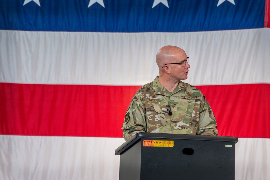 Col. Weyand speaks from a podium