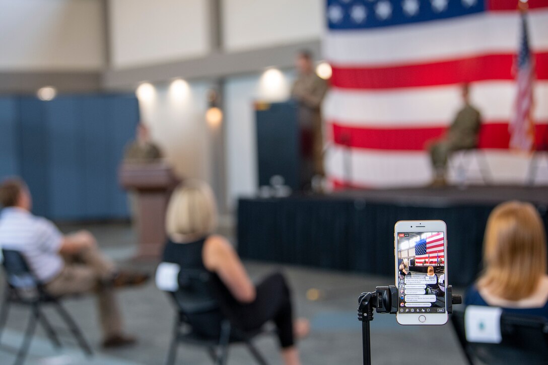 a phone live streams the ceremony