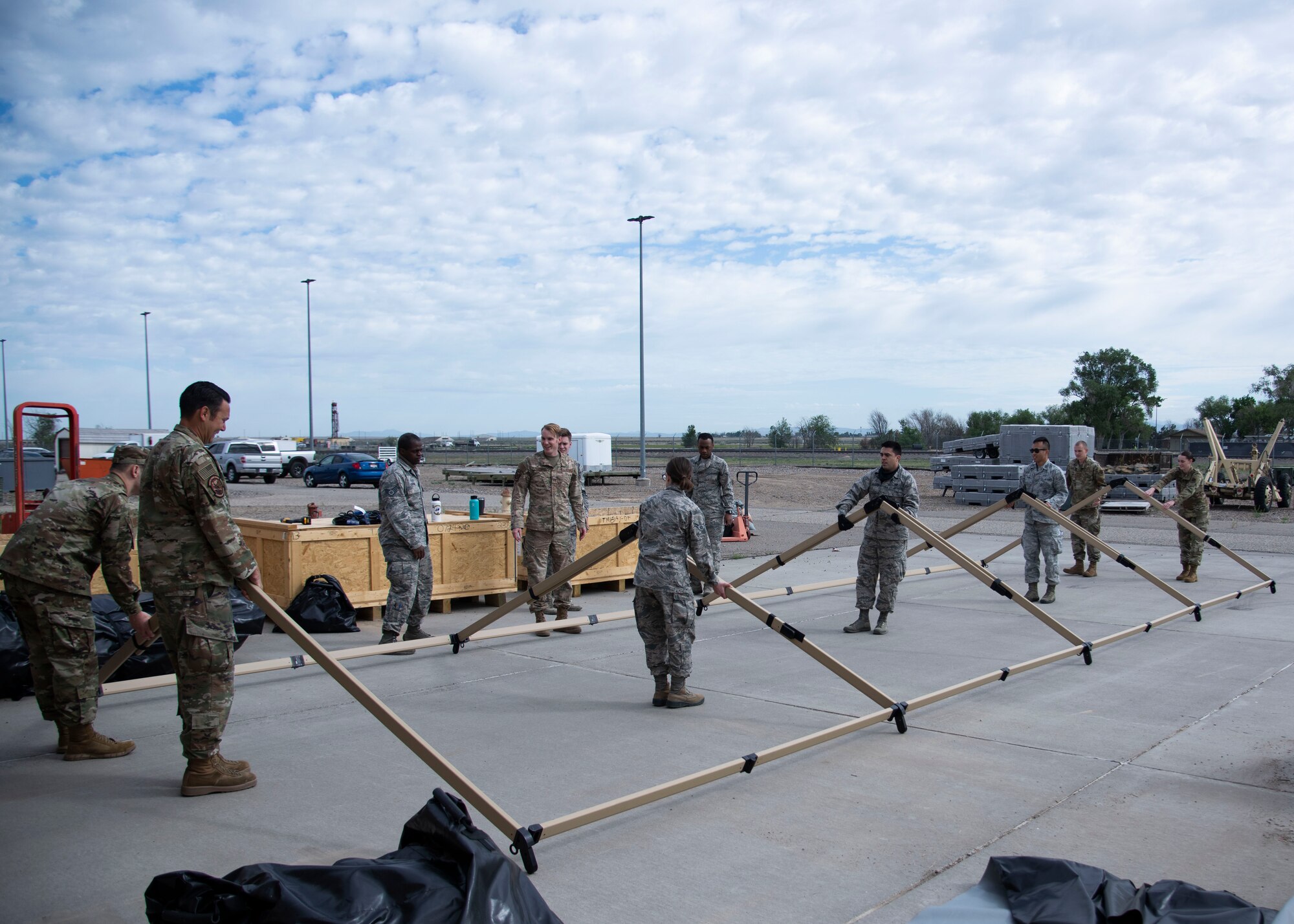 366th Fighter Wing A2 (Intell) Airmen expand the support structure for the TM60 tent, June 3, 2020, at Mountain Home Air Force Base, Idaho,. The TM60 will serve as the Mission Planning Cell in an Agile Combat Employment operation. (U.S. Air Force photo by Airman 1st Class Nicholas Swift)