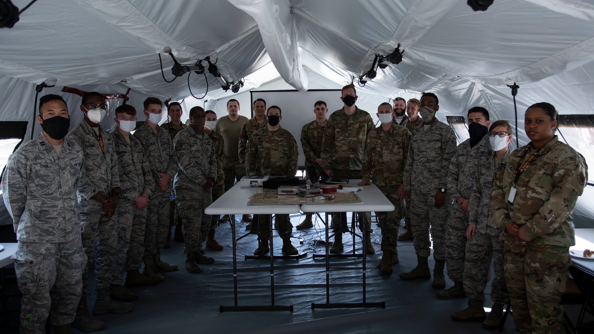 366th Fighter Wing A2 Airmen pose for a group photo in a fully set up mock Agile Combat Employment (ACE) mission planning cell, June 3, 2020, on Mountain Home Air Force Base, Idaho. This is the first time A2 Airmen had fully assembled the ACE-MPC. (U.S. Air Force photo by Airman 1st Class Nicholas Swift