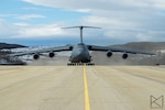 A C-5M Super Galaxy aircraft, assigned to the 433rd Airlift Wing, Joint Base San Antonio-Lackland, Texas, taxies the runway at Royal Norwegian Air Force Bardufoss Air Station, Norway, May 26th, 2020.