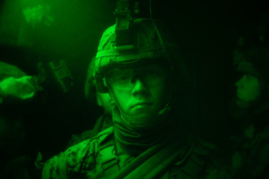 U.S. Marines with Bravo Company, Battalion Landing Team 1/4, 15th Marine Expeditionary Unit, ride in the back of an AAV-P7/A1 assault amphibious vehicle during Realistic Urban Training at Marine Corps Base Camp Pendleton, California, June 13, 2020. RUT enhances the integration and collective capability of the MEU's command, air, ground and logistics elements while conducting a series of challenging and realistic training events. (U.S. Marine Corps photo by Cpl. Britany Rowlett)