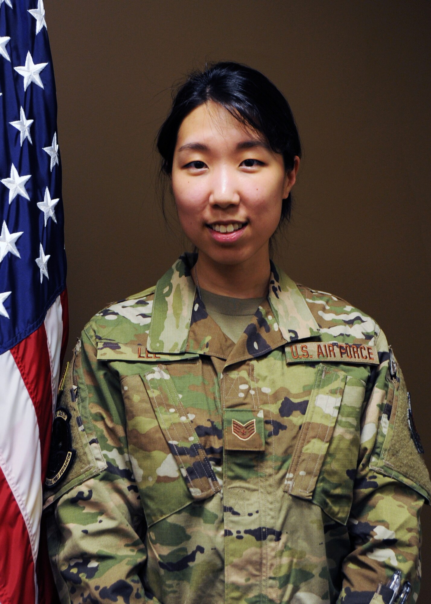 Staff Sgt. Dana Lee, 69th Aerial Port Squadron, air transportation technician, poses for a photo after being sworn into active duty June 15, 2020, at Joint Base Andrews, Md. Lee is one of eight Airmen selected Air Force-wide for the Enlisted to Medical Degree Preparatory Program. (U.S. Air Force photo by Staff Sgt. Cierra Presentado)