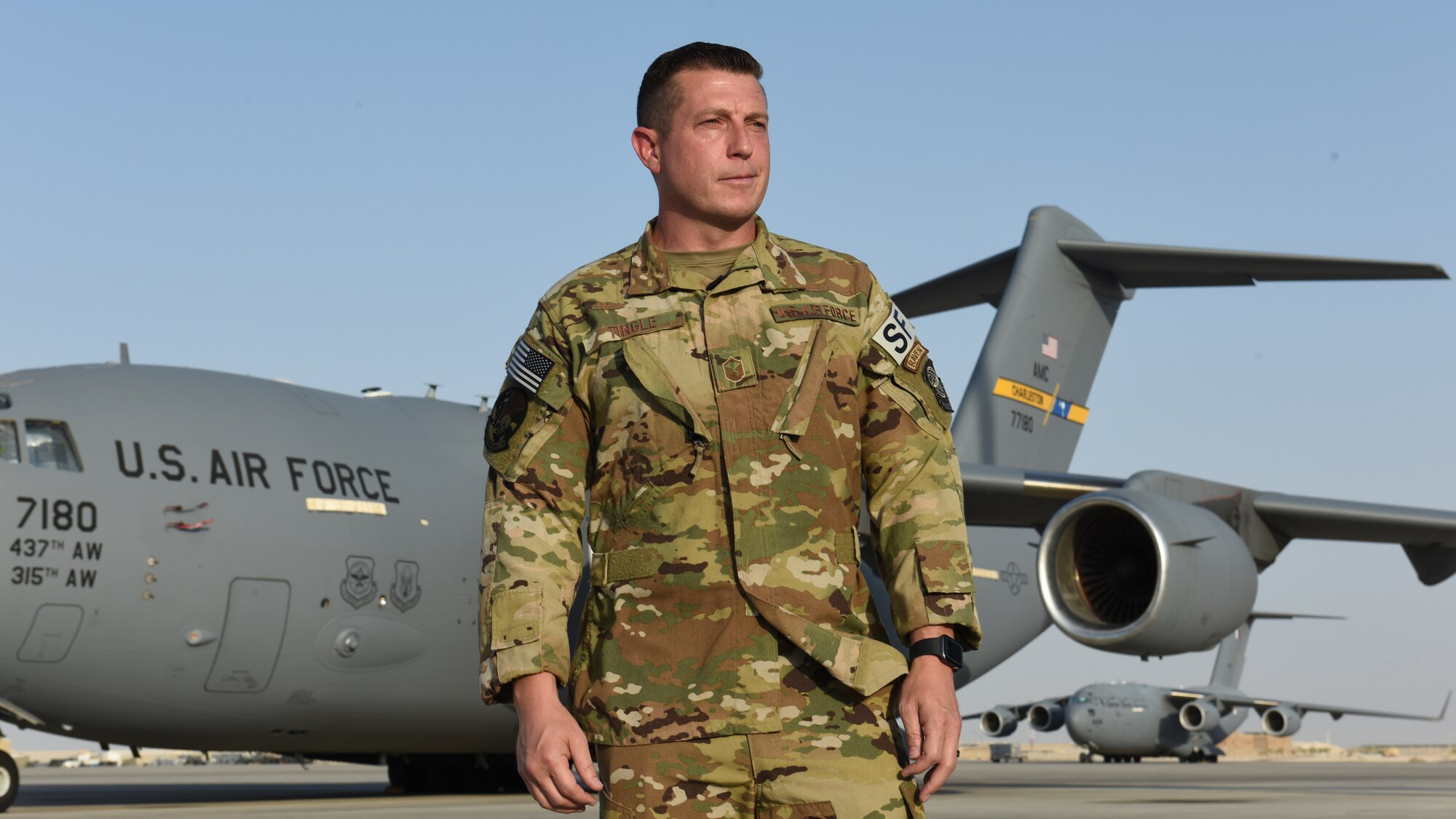 Master Sergeant David Tingle, 816th Expeditionary Airlift Squadron Raven, stands on the flight line at Al Udeid Air Base, Qatar, June 4, 2020. U.S. Air Force Phoenix Ravens are an elite group of Security Forces Airmen that deploy to austere locations and secure flight lines in the U.S. Air Forces Central Command Area of Responsibility to ensure safety of an aircraft and its crew. (U.S. Air Force photo by Senior Airman Shay Stuart)