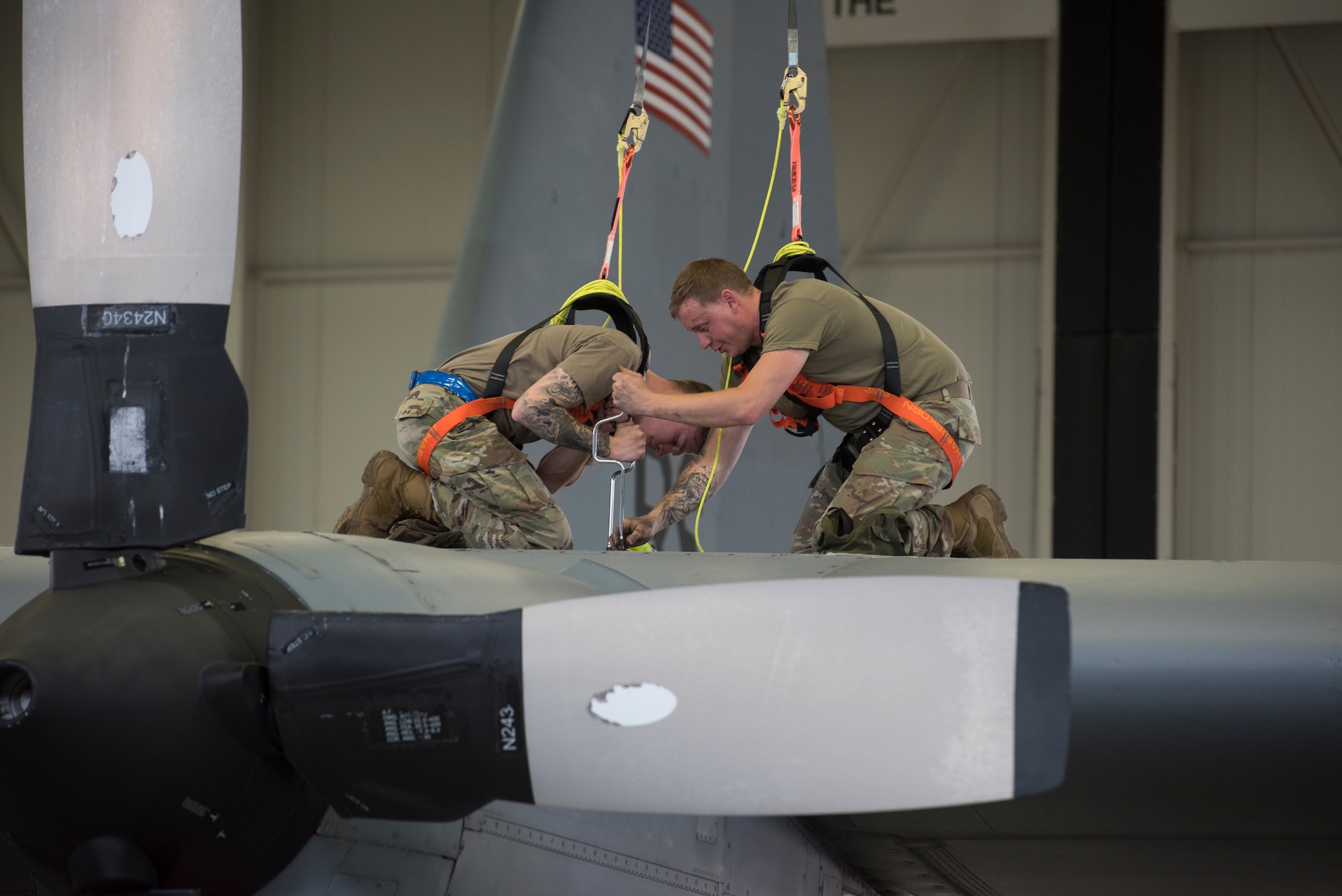 A photo of Airmen working on an aircraft.