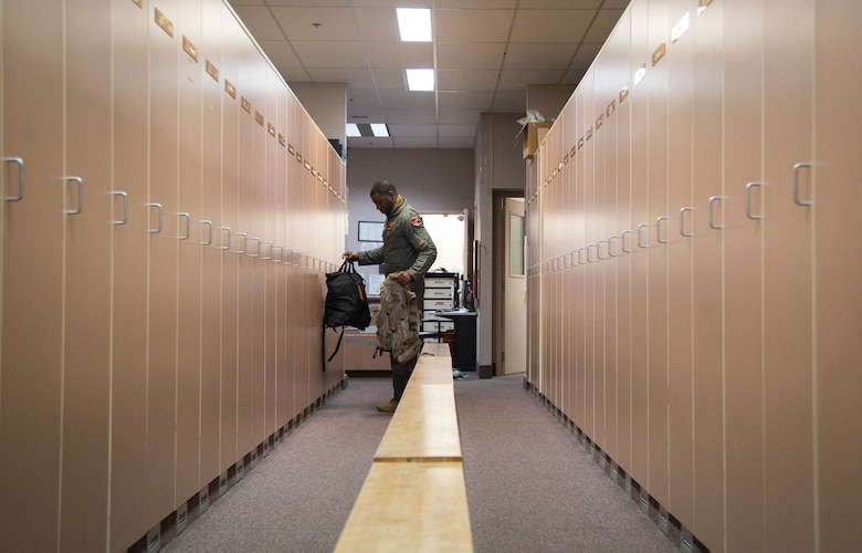 Capt. Dane McKenzie, 343rd Bomb Squadron electronic warfare officer, collects his equipment from his locker at Eielson Air Force Base, Alaska, for a Bomber Task Force mission, June 16, 2020. Bomber Task Force missions help maintain global stability and security while enabling units to become familiar with operations in different regions. (U.S. Air Force photo by Senior Airman Lillian Miller)