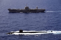 PHILLIPPINE SEA (June 14, 2020) Los Angeles-class fast-attack submarine, USS Asheville (SSN 758), transits alongside U.S. 7th Fleet flagship USS Blue Ridge (LCC 19) during a submarine familiarization (SUBFAM). The SUBFAM was conducted so Blue Ridge's crew and embarked 7th Fleet staff could observe the characteristics of a submarine and how it looks both digitally and visually at periscope depth. Blue Ridge is the oldest operational ship in the Navy, and, as 7th Fleet flagship, actively works to foster relationships with allies and partners in the Indo-Pacific region.