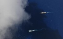 PHILLIPPINE SEA (June 14, 2020) Los Angeles-class fast-attack submarine, USS Asheville (SSN 758), transits alongside U.S. 7th Fleet flagship USS Blue Ridge (LCC 19) during a submarine familiarization (SUBFAM). The SUBFAM was conducted so Blue Ridge's crew and embarked 7th Fleet staff the opportunity to observe the characteristics of a submarine and how it looks both digitally and visually at periscope depth. Blue Ridge is the oldest operational ship in the Navy, and, as 7th Fleet flagship, actively works to foster relationships with allies and partners in the Indo-Pacific region.