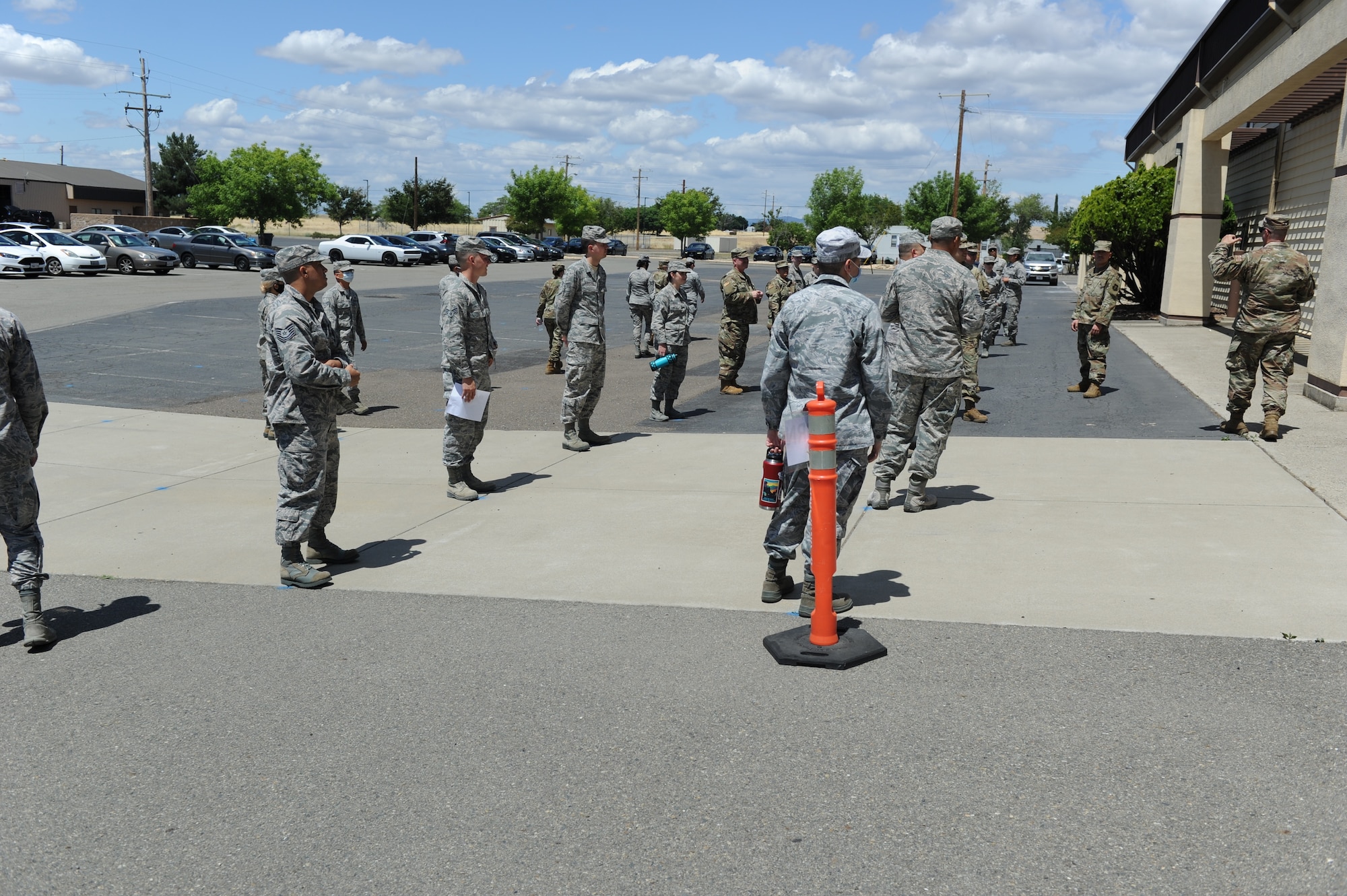 Airmen assigned to the 940th Air Refueling wing wait to enter the Civil Engineer warehouse June 13 at Beale Air Force Base, California.