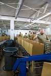 Soldiers from the 1433rd and 1434th Engineer Companies, Michigan Army National Guard, package over 1,000 meal boxes a day at Gleaners Community Food Bank in Pontiac in response to COVID-19, May 20, 2020. Guard members are serving at six food distribution sites across the state.