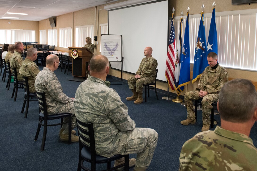 During an assumption of command ceremony for 167th Mission Support Group attendees were limited and maintained social distance at the 167th Airlift Wing, Martinsburg, W. Va., June 11, 2020. Airmen returned to base for the first unit training assembly in two months, after regularly-scheduled training events were cancelled in April and May because of COVID-19 precautions. Airmen are using, homemade masks, social distancing, staggered schedules, and plexiglass barriers to defend themselves from the virus.