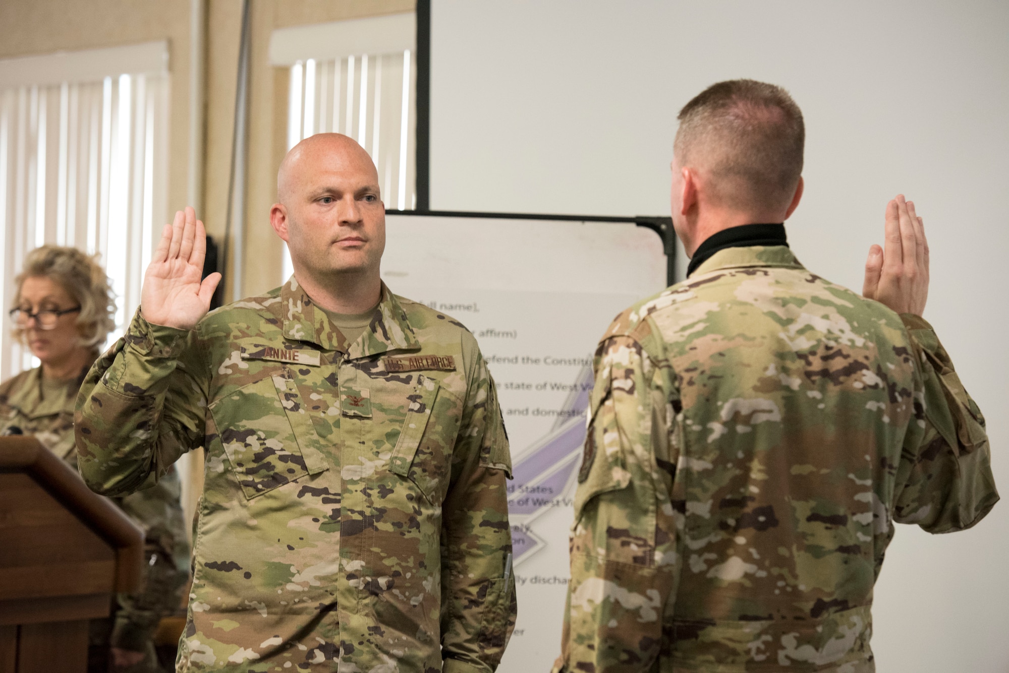 Col. Bill Annie takes the oath of office upon his promotion to colonel during a ceremony held in the 167th Airlift Wing's dining facility, June 13, 2020. Annie also assumed command of the 167th Missin Support group during the ceremony.