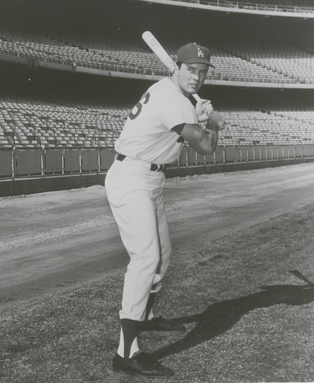 Baseball player is pictured at bat.