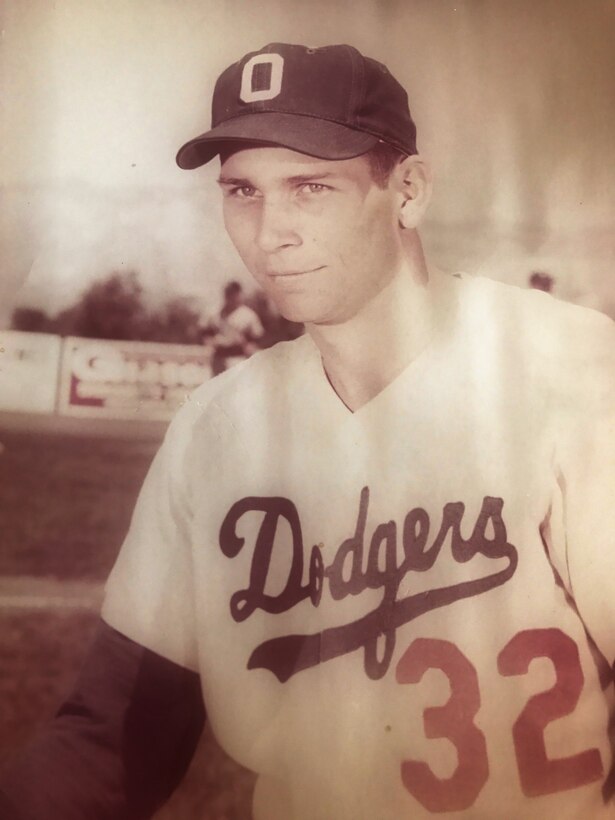 Baseball player in a Ogden (Utah) Dodgers uniform poses for a photo.