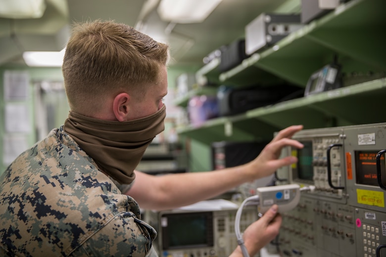 U.S. Marines with Marine Aviation Logistics Squadron (MALS) 13, calibrate aircraft electronics on Marine Corps Air Station (MCAS) Yuma, May 27, 2020. The calibration work center is responsible for maintaining mission readiness across all MCAS Yuma tenant squadrons and 6,000 items through calibration and equipment repair for aircraft electronics, armory gauges, and weapon test sets. (U.S. Marine Corps photo by Lance Cpl John Hall)