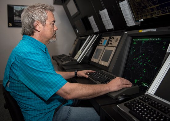 David Bowles monitors aircraft in radar approach control facility