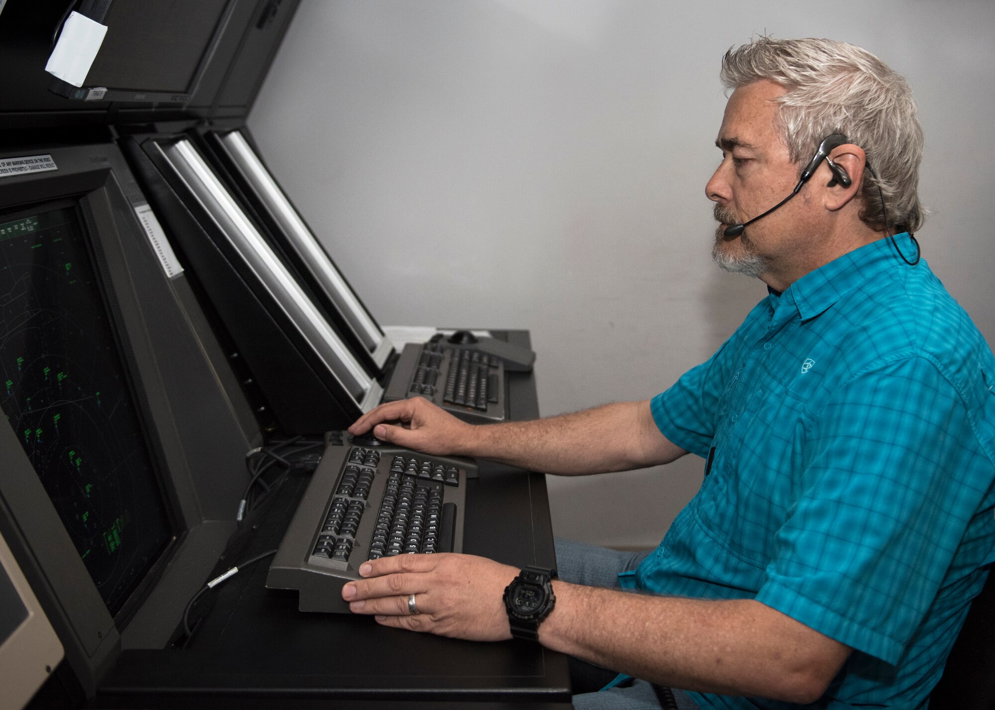 David Bowles monitors aircraft in radar approach control facility