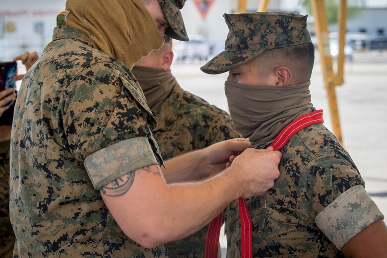 U.S. Marine Corps Cpl. Victor Menchu, an electrician with Combat Logistics Company (CLC) 16, is meritoriously promoted to the rank of Corporal on Marine Corps Air Station Yuma, June 2, 2020. A meritorious promotion is based on the individual Marines ability to take on the responsibilities and duties of a higher grade in an effective manner by being evaluated on knowledge, drill, physical fitness, and military appearance. (U.S. Marine Corps photo by Lance Cpl John Hall)