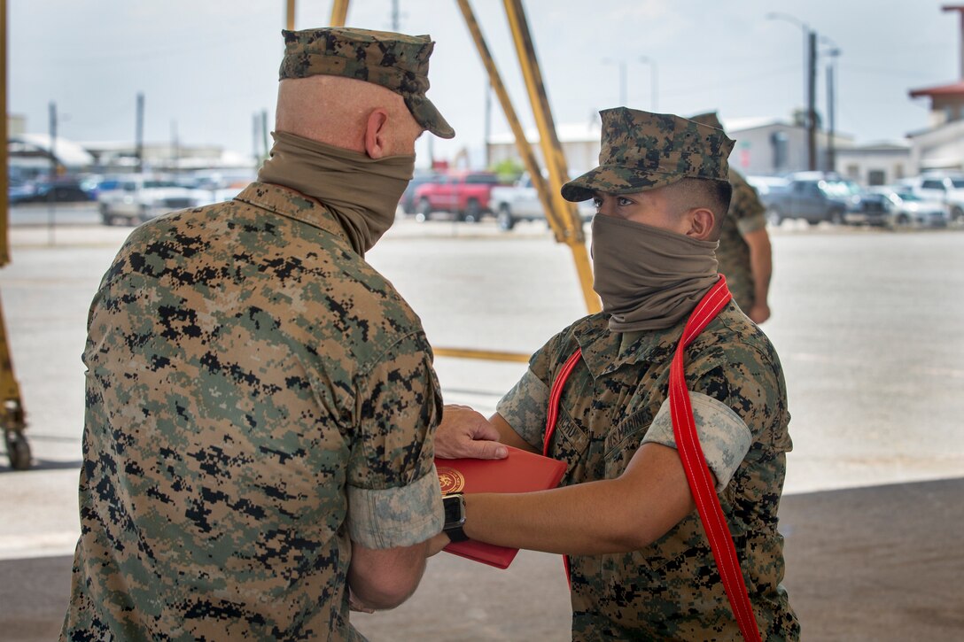 U.S. Marine Corps Cpl. Victor Menchu, an electrician with Combat Logistics Company (CLC) 16, is meritoriously promoted to the rank of Corporal on Marine Corps Air Station Yuma, June 2, 2020. A meritorious promotion is based on the individual Marines ability to take on the responsibilities and duties of a higher grade in an effective manner by being evaluated on knowledge, drill, physical fitness, and military appearance. (U.S. Marine Corps photo by Lance Cpl John Hall)