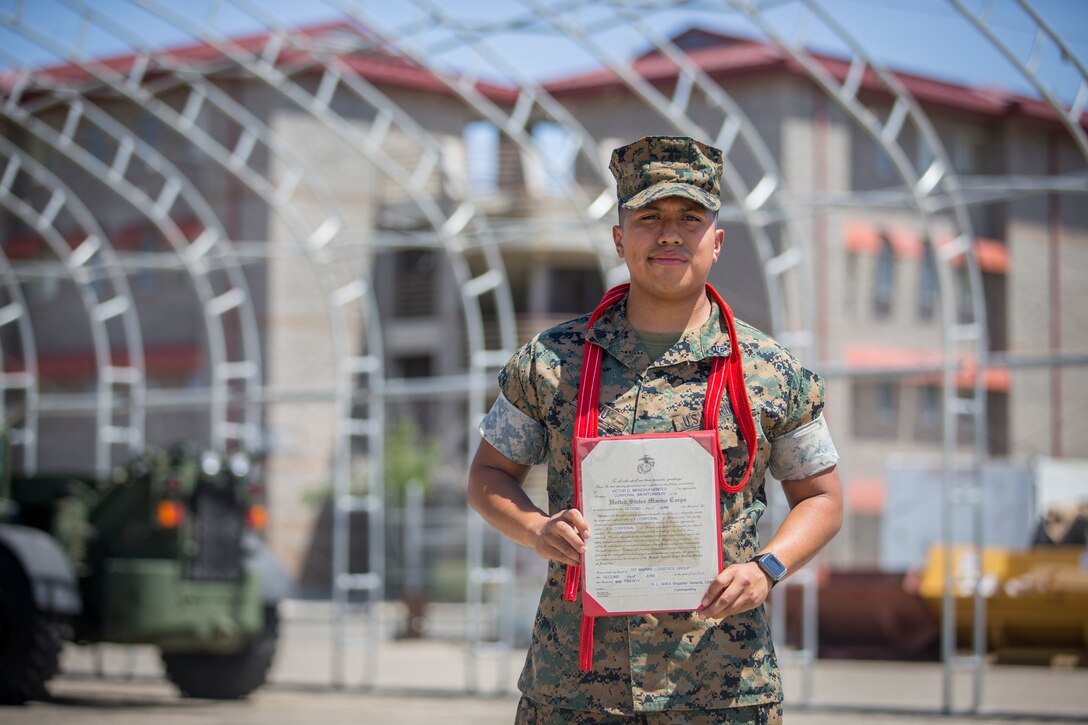 U.S. Marine Corps Cpl. Victor Menchu, an electrician with Combat Logistics Company (CLC) 16, is meritoriously promoted to the rank of Corporal on Marine Corps Air Station Yuma, June 2, 2020. A meritorious promotion is based on the individual Marines ability to take on the responsibilities and duties of a higher grade in an effective manner by being evaluated on knowledge, drill, physical fitness, and military appearance. (U.S. Marine Corps photo by Lance Cpl John Hall)