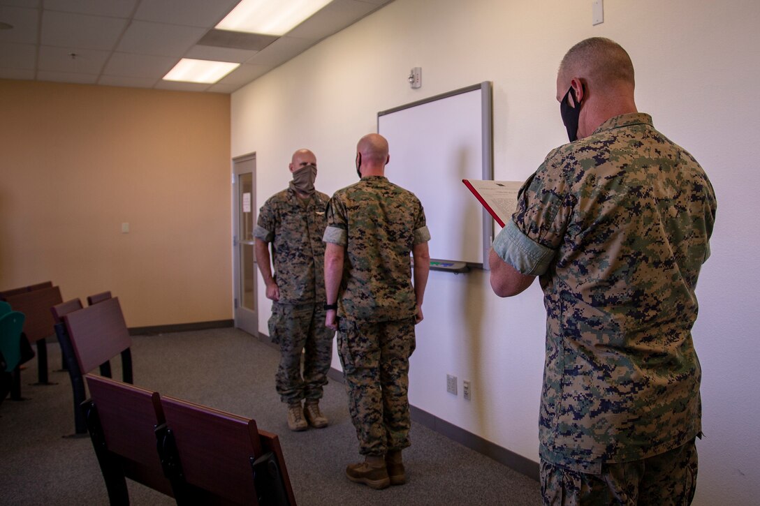 U.S. Marine Corps Lt. Col. Henry Hortenstine, an operations officer, was awarded the Meritorious Service Medal by Col. David A. Suggs, commanding officer, Marine Corps Air Station (MCAS) Yuma at the base operations building, June 4, 2020. During Sentinel Edge 2019, Hortenstine led the largest exercise in Marine Corps history, moving troops and equipment in an effort to build new roads and integrate Marine Forces Reserve with active-duty Marines. (U.S. Marine Corps photo by LCpl Gabrielle Sanders)