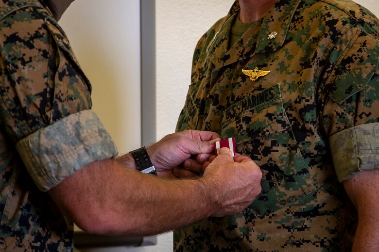 U.S. Marine Corps Lt. Col. Henry Hortenstine, an operations officer, was awarded the Meritorious Service Medal by Col. David A. Suggs, commanding officer, Marine Corps Air Station (MCAS) Yuma at the base operations building, June 4, 2020. During Sentinel Edge 2019, Hortenstine led the largest exercise in Marine Corps history, moving troops and equipment in an effort to build new roads and integrate Marine Forces Reserve with active-duty Marines. (U.S. Marine Corps photo by LCpl Gabrielle Sanders)