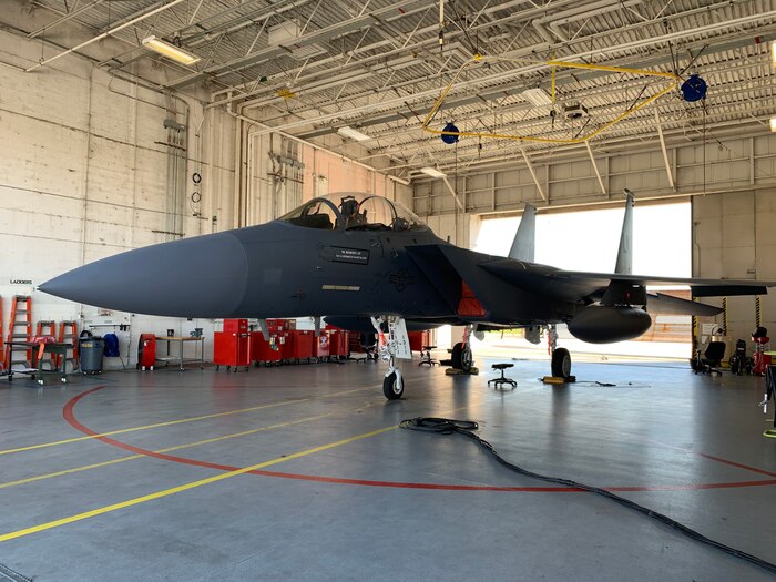 Photo shows close up view of name painted unto F-15 below the cockpit.