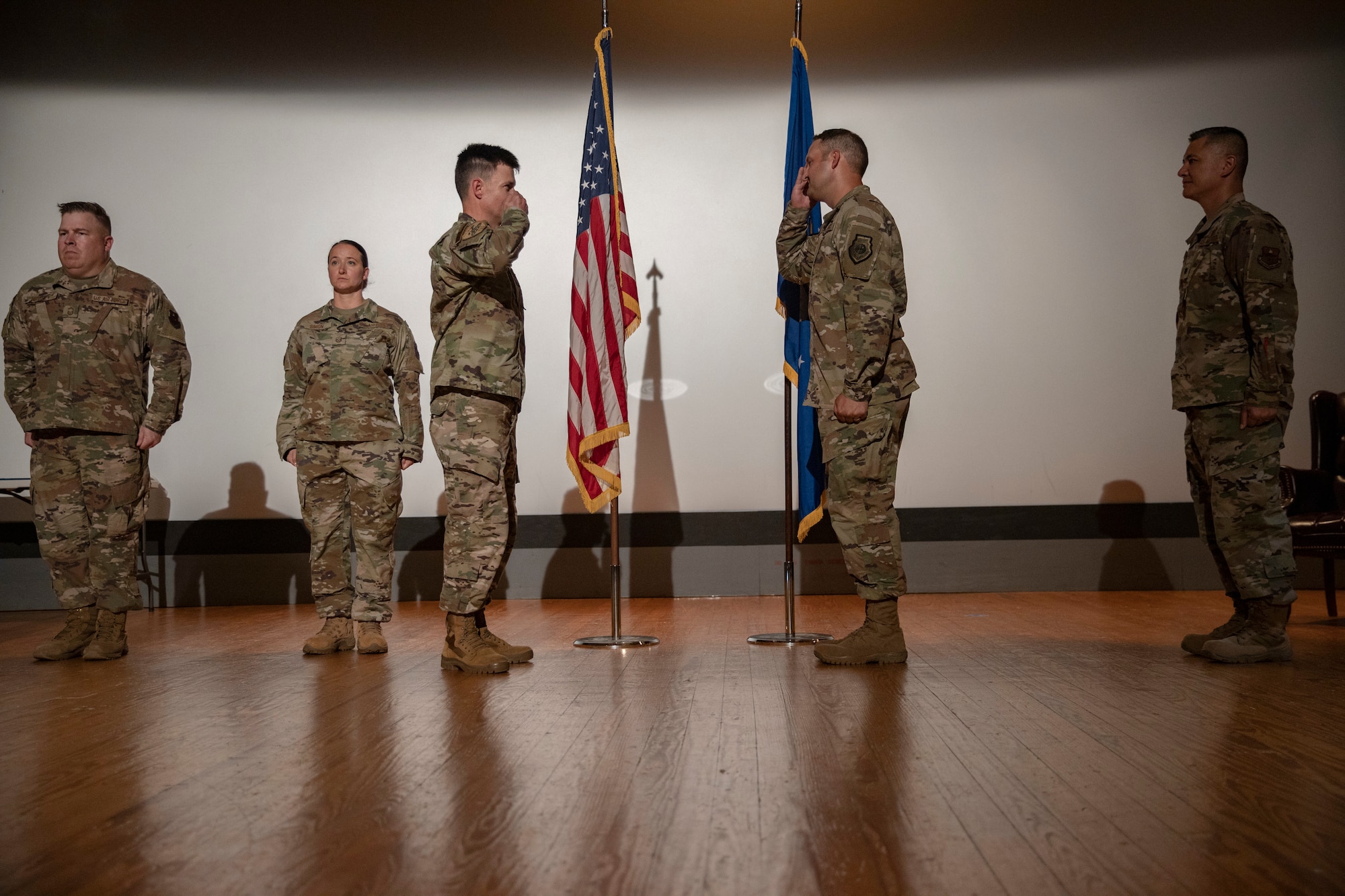 U.S. Air Force Col. Thomas Coakley, 17th TRG commander, solutes  Lt Col. John Bergmans at the base theater, on Goodfellow Air Force Base, Texas, June 17, 2020.  The change of command ceremony is a time honored military tradition that signifies the orderly transfer of authority. (Courtesy photo)