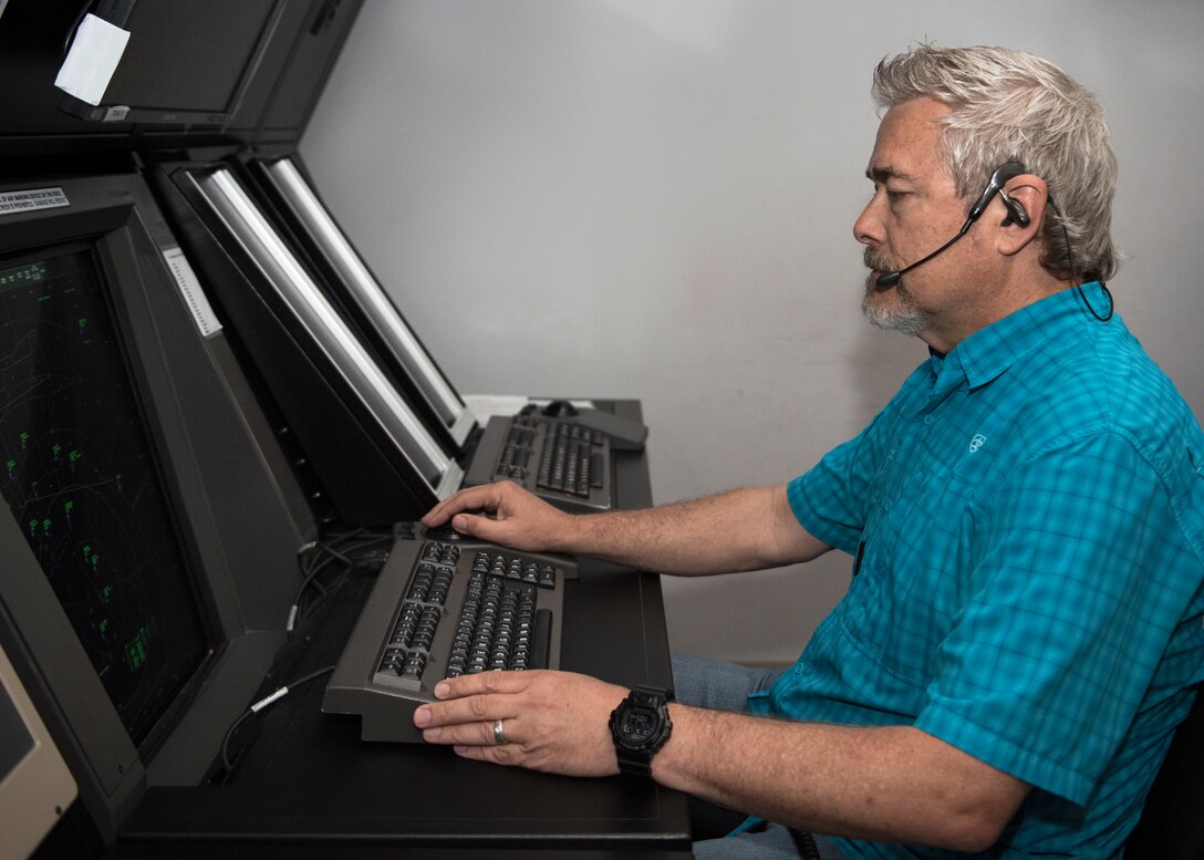 David Bowles monitors aircraft in radar approach control facility