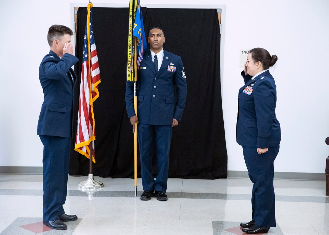 U.S. Air Force Col. Thomas Coakley, 17th Training Group commander and Lt Col. Linda Davis, 17th Training Support Squadron incoming commander, salute each other at the 17th TRSS Change of Command ceremony, at the event center on Goodfellow Air Force Base, Texas, June 16, 2020.  The ceremony held less than 10 people to adhere to social distancing and COVID-19 restrictions. (courtesy photo)