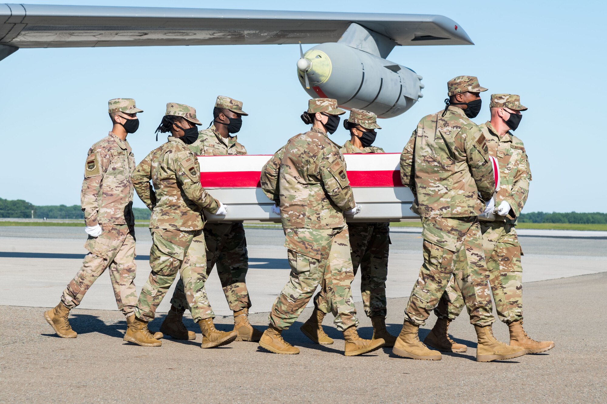 A U.S. Air Force carry team transfers the remains of 1st Lt. Kenneth G. Allen, of Perry, Utah, during a dignified transfer June 18, 2020, at Dover Air Force Base, Delaware. Allen was assigned to the 493rd Fighter Squadron, Royal Air Force Lakenheath, U.K. (U.S. Air Force photo by Roland Balik)